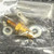 Vintage 2N3745 NPN power transistor and mounting hardware sealed in a plastic bag, showing the gold case stud.