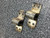 Two Bulletin 7322 L180 overload relay heaters, metallic and slightly worn, with mounting holes.