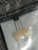 Black TO-92 marked ECG 159, leads held in kraft paper tape, on bag