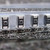 Vishay 293D226X9016C2T tantalum SMD capacitors seated in embossed carrier tape.