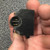 Angled view of MMB1 light module socket, gold contact blades and mounting hole