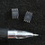 Winbond 25X16BVSIG eight-pin SOIC flash chip and second marked chip beside pen tip