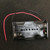 BH-321-5 two-cell AA battery holder, empty, molded 1.5V UM-3 X2 marks, red black leads