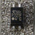 Top view of a black four-lead optocoupler marked with the Toshiba logo and P721F