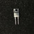 Two-lead full-pack diode with mounting hole, marked BY459X and 1500, on dark speckled surface
