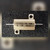Gold aluminum TEPRO TM resistor housing marked 5W, two mounting tabs, flat wire terminals