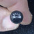 Matte black metal can top marked ETCO over 2N2048 in white print; surface shows minor texture variation, no visible damage.