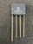 Flat-pack body marked UL, 9136, GI KBL06 with + and - polarity labels; four straight leads, no visible damage.