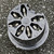 Rear of the contact insert: seven contact cavities with silver-coloured contacts around a central post