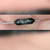 Fingers hold black axial resistor printed TEPRO, TS 1W, 12.5, and 0.05%