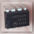 Motorola LM393AN dual comparator IC in DIP-8 package with visible top markings and date code 9704.