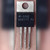 National Semiconductor LM317T TO-220 regulator held in hand, metal tab and LM317T P+ marking visible