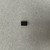Black DIP-8 plastic package; top markings too small to read at this resolution. Pin 1 dot visible on upper-left corner.