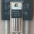 Texas Instruments LM2575T-ADJ voltage regulator in a 5-pin TO-220 package, front view showing markings.