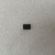 DIP-8 black plastic package with pin-1 notch visible. Top markings too small to read at this resolution.