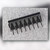 Edge view of the 16-pin DIP showing one row of leads splayed slightly