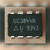 Black 8-pin DIP held in a palm, marked UC3844N with Unitrode triangle-U logo and 9343