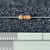 Xicon 291-47K axial resistor with yellow, violet, orange, and gold color bands above a ruler.