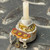 Mallory MLCN55L 500K ohm potentiometer held in palm, plastic shaft and solder lugs visible