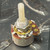Angled view of embossed can marking and gold-colored rivets on red phenolic wafer