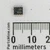 SOIC-8 integrated circuit marked 358 over 823A with pin-1 dot beside a millimeter ruler