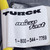 White label with TURCK and microfast branding visible; yellow TPU jacket exits both ends of label. Minor smudge on label face.