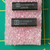 Three Harris I3-508A-5 DIP chips on pink anti-static wrap over green measuring mat