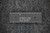Temic TSC80C31-12CA microcontroller, wider straight-on overhead view against dark textured background.