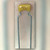 Close-up of small yellow dipped ceramic capacitor marked 0223 K5C on formed radial leads