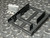 Qook X001JLINVD black metal dual SSD bracket at an angle with bag of mounting screws