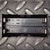 Black plastic 2-cell holder with BeilaMoo molded brand, PARALLEL/SERIES polarity labels in English and Chinese, four metal spring contacts visible.