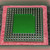 Underside pin grid array, three rows of straight pins around open green center