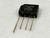 Black molded SIP package marked TAIWAN, 9003, 2KBP02M, GI, 3N255. Four gold-tone leads. + and - polarity symbols visible on face.