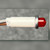 Side profile of Jemco 2 VDC red LED indicator lamp with grey and brown leads