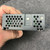 Top-down view of EWS15-12 terminal block, clear cover and NEMIC-LAMBDA marking