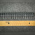 Top view of Curtis T37040-16-0 terminal block beside inch ruler showing about 6.7 inch length