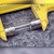 Close-up of 51NM glass cartridge fuse showing stamped end caps and internal element wire.