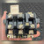 Front angled view showing TRIPPED indicator area, reset lever, and terminal block screws.
