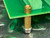 Brass hex standoff at board corner, brass fitting on top face, steel nut at base