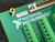 Corner detail showing brass standoff, barcode label 110BC1C and National Instruments logo