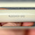 Macro of NL523W04-048 side marking printed on glazed cream ceramic insulator body