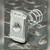 Channel spring nut on dark tread plate, raised 228 marking above threaded hole