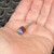 Merit 08834137472 120 grit mounted flap wheel resting in an open hand.