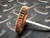 Angled edge view showing stacked abrasive flaps and amber core on the mandrel