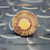 Back face view of Merit 08834137602 flap wheel showing the solid amber epoxy center.