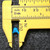 56pF 1KV ceramic capacitor measured with calipers showing body width of approximately 5 mm.