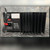 Rear panel: spec label, red 115 voltage selector, IEC inlet and fuse caution legend