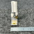 Square D AR-2.71 heater element close-up standing on textured surface, single L-shaped bracket with brass eyelet.