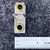 Top view of GE C6.95A heater, curved wire between brass eyelets on fiber base