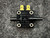 A top view of the World Magnetics pressure switch PSF100A from PartsMine.com, highlighting the dual terminals and barbed fittings for pressure connections.